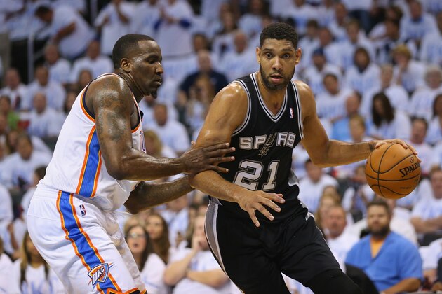 OKLAHOMA CITY, OK - MAY 31:  Tim Duncan #21 of the San Antono Spurs drives with the ball against Kendrick Perkins #5 of the Oklahoma City Thunder in the first half during Game Six of the Western Conference Finals of the 2014 NBA Playoffs at Chesapeake Energy Arena on May 31, 2014 in Oklahoma City, Oklahoma. NOTE TO USER: User expressly acknowledges and agrees that, by downloading and or using this photograph, User is consenting to the terms and conditions of the Getty Images License Agreement.  (Photo by Ronald Martinez/Getty Images)