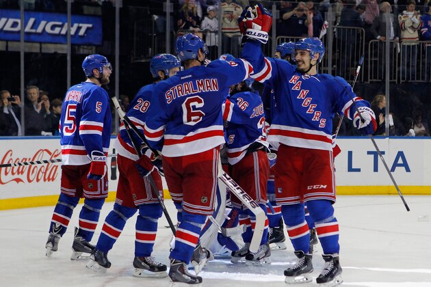 NEW YORK, NY - MAY 29:  Chris Kreider #20 and Anton Stralman #6 of the New York Rangers celebrates after defeating the Montreal Canadiens in Game Six to win the Eastern Conference Final in the 2014 NHL Stanley Cup Playoffs at Madison Square Garden on May 29, 2014 in New York City.Rangers defeated the Candiens 1-0.  (Photo by Mike Stobe/Getty Images)