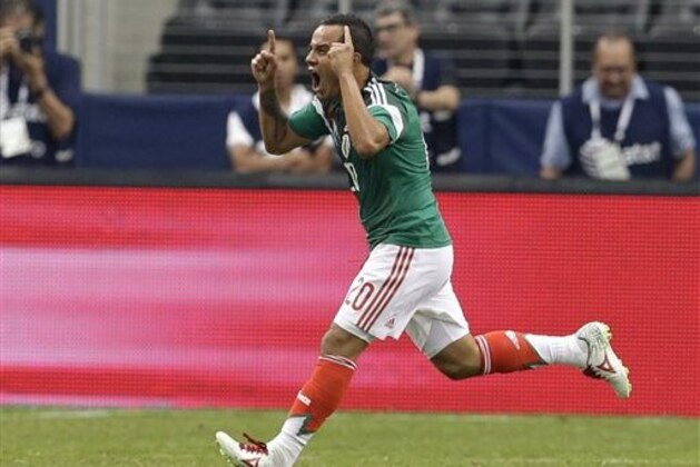 Mexico's Luis Montes celebrates after scoring against Ecuador in the first half of a friendly soccer match, Saturday, May 31, 2014, in Arlington, Texas.  (AP Photo/Tony Gutierrez)