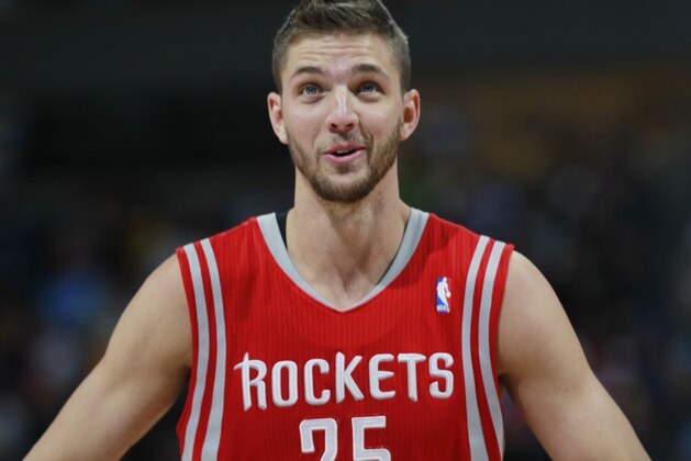 Houston Rockets forward Chandler Parsons looks on against the Denver Nuggets in the third quarter of the Nuggets' 123-116 victory in an NBA basketball game in Denver on Wednesday, April 9, 2014. (AP Photo/David Zalubowski)