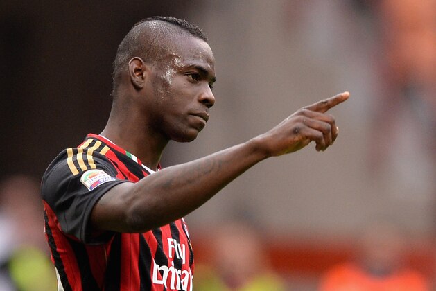 MILAN, ITALY - APRIL 19:  Mario Balotelli of AC Milan celebrates scoring the first goal during the Serie A match between AC Milan and AS Livorno Calcio at San Siro Stadium on April 19, 2014 in Milan, Italy.  (Photo by Claudio Villa/Getty Images)