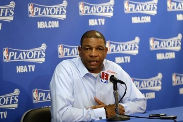 Los Angeles Clippers head coach Doc Rivers, right, answers questions during a pregame news conference before Game 4 of an opening-round NBA basketball playoff series against the Golden State Warriors on Sunday, April 27, 2014, in Oakland, Calif. (AP Photo/Marcio Jose Sanchez)