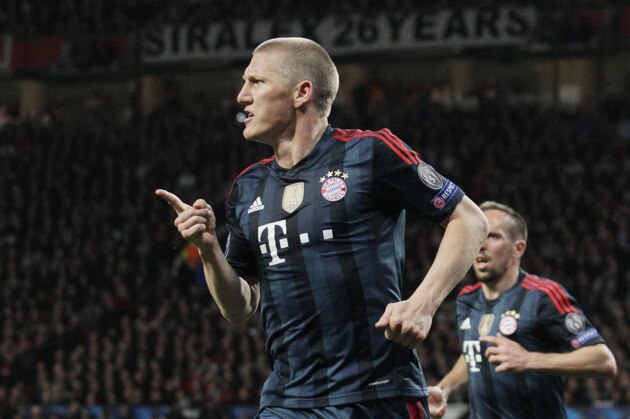 Bayern's Bastian Schweinsteiger celebrates scoring his side's first goal during the Champions League quarterfinal first leg soccer match between Manchester United and Bayern Munich at Old Trafford Stadium, Manchester, England, Tuesday, April 1, 2014.(AP Photo/Jon Super)