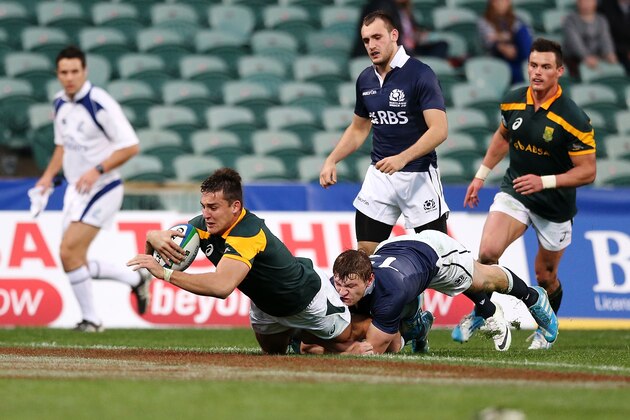 AUCKLAND, NEW ZEALAND - JUNE 02: Lloyd Greef of South Africa scores a try against Neil Herron of Scotland during the 2014 Junior World Championships match between South Africa and Scotland at QBE Stadium on June 2, 2014 in Auckland, New Zealand. (Photo by Anthony Au-Yeung/Getty Images) AUCKLAND, NEW ZEALAND - JUNE 02: Lloyd Greef of South Africa scores a try against Neil Herron of Scotland during the 2014 Junior World Championships match between South Africa and Scotland at QBE Stadium on June 2, 2014 in Auckland, New Zealand. (Photo by Anthony Au-Yeung/Getty Images)