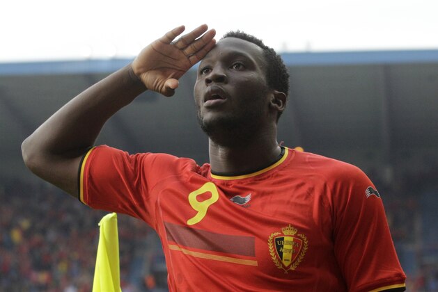 Belgium's Romelu Lukaku salutes after he scored against Luxembourg, during a friendly soccer match at the Cristal Arena stadium in Genk, eastern Belgium, Tuesday, May 26, 2014. Belgium will play against South Korea, Russia and Algeria in Group H of the World Cup 2014 in Brazil. (AP Photo/Yves Logghe) Belgium's Romelu Lukaku salutes after he scored against Luxembourg, during a friendly soccer match at the Cristal Arena stadium in Genk, eastern Belgium, Tuesday, May 26, 2014. Belgium will play against South Korea, Russia and Algeria in Group H of the World Cup 2014 in Brazil. (AP Photo/Yves Logghe)