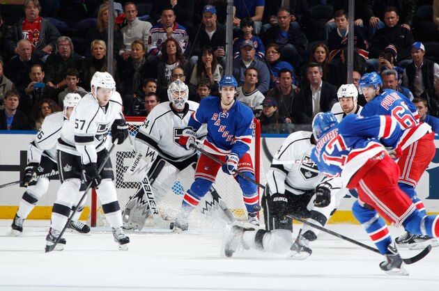 NEW YORK, NY - NOVEMBER 17:  Ben Scrivens #54 of the Los Angeles Kings looks through a screen to locate a shot taken by John Moore #17 of the New York Rangers at Madison Square Garden on November 17, 2013 in New York City. (Photo by Scott Levy/NHLI via Getty Images)
