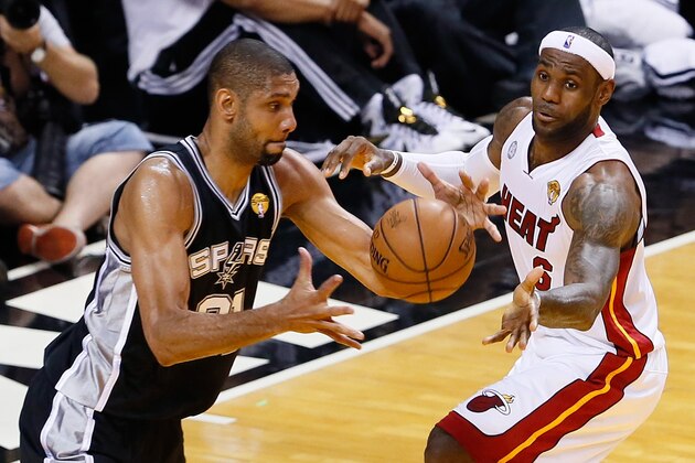 MIAMI, FL - JUNE 20:  Tim Duncan #21 of the San Antonio Spurs with the ball against LeBron James #6 of the Miami Heat in the first half during Game Seven of the 2013 NBA Finals at AmericanAirlines Arena on June 20, 2013 in Miami, Florida. NOTE TO USER: User expressly acknowledges and agrees that, by downloading and or using this photograph, User is consenting to the terms and conditions of the Getty Images License Agreement.  (Photo by Kevin C. Cox/Getty Images)