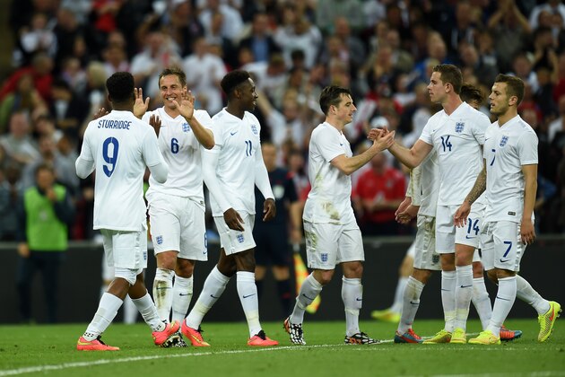 LONDON, ENGLAND - MAY 30:  Phil Jagielka of England is congratulated by team mates on scoring their third goal during the international friendly match between England and Peru at Wembley Stadium on May 30, 2014 in London, England.  (Photo by Shaun Botterill/Getty Images)