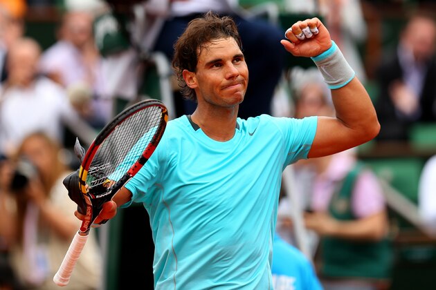 PARIS, FRANCE - JUNE 02:  Rafael Nadal of Spain celebrates victory in his men's singles match against Dusan Lajovic of Serbia on day nine of the French Open at Roland Garros on June 2, 2014 in Paris, France.  (Photo by Clive Brunskill/Getty Images)