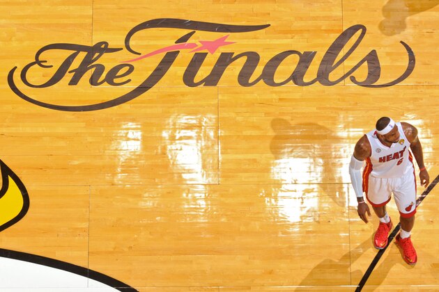 MIAMI, FL - JUNE 18: LeBron James #6 of the Miami Heat walks past 'The Finals' logo on court while playing the San Antonio Spurs during Game Six of the 2013 NBA Finals on June 18, 2013 at American Airlines Arena in Miami, Florida. NOTE TO USER: User expressly acknowledges and agrees that, by downloading and or using this photograph, User is consenting to the terms and conditions of the Getty Images License Agreement. Mandatory Copyright Notice: Copyright 2013 NBAE (Photo by Jesse D. Garrabrant/NBAE via Getty Images) MIAMI, FL - JUNE 18: LeBron James #6 of the Miami Heat walks past 'The Finals' logo on court while playing the San Antonio Spurs during Game Six of the 2013 NBA Finals on June 18, 2013 at American Airlines Arena in Miami, Florida. NOTE TO USER: User expressly acknowledges and agrees that, by downloading and or using this photograph, User is consenting to the terms and conditions of the Getty Images License Agreement. Mandatory Copyright Notice: Copyright 2013 NBAE (Photo by Jesse D. Garrabrant/NBAE via Getty Images)