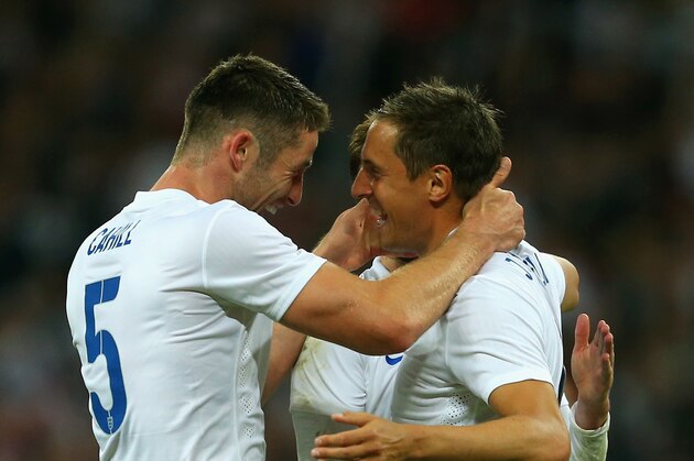 LONDON, ENGLAND - MAY 30:  Gary Cahill of England congratulates Phil Jagielka of England on scoring their third goal during the international friendly match between England and Peru at Wembley Stadium on May 30, 2014 in London, England.  (Photo by Warren Little/Getty Images)
