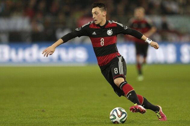 Germany's Mesut Ozil controls the ball during the international friendly soccer match between Germany and Chile in Stuttgart, Germany, Wednesday, March 5, 2014. (AP Photo/Matthias Schrader)