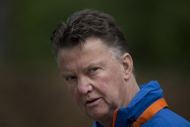 FILE - In this Thursday, May 15, 2014 file photo, Louis Can Gaal, coach of the Dutch national soccer team walks towards the mixed zone after a team training in Hoenderloo, eastern Netherlands. Manchester United has hired Netherlands coach Louis Van Gaal as the club’s new manager it was announced on Monday, May 19, 2014. Van Gaal, who will leave his position with the Dutch after the upcoming World Cup in Brazil, replaces David Moyes following his firing last month after just 10 months in charge.  (AP Photo/Peter Dejong, File)