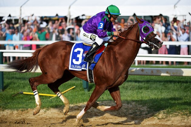BALTIMORE, MD - MAY 17:  California Chrome #3, ridden by Victor Espinoza, races during the 139th running of the Preakness Stakes at Pimlico Race Course on May 17, 2014 in Baltimore, Maryland.  (Photo by Molly Riley/Getty Images)