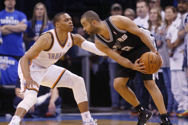 San Antonio Spurs guard Tony Parker (9) attempts to drive around Oklahoma City Thunder guard Russell Westbrook (0) inthe first quarter of Game 4 of the Western Conference finals NBA basketball playoff series in Oklahoma City, Tuesday, May 27, 2014.  (AP Photo/Sue Ogrocki)