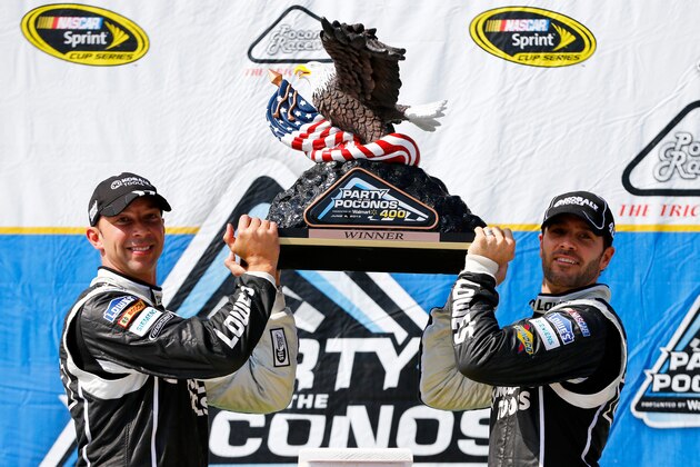 LONG POND, PA - JUNE 09:  Jimmie Johnson, driver of the #48 Lowe's/Kobalt Tools Chevrolet, celebrates with his crew chief Chad Knaus in Victory Lane after winning the NASCAR Sprint Cup Series Party in the Poconos 400 at Pocono Raceway on June 9, 2013 in Long Pond, Pennsylvania.  (Photo by Jared Wickerham/Getty Images)