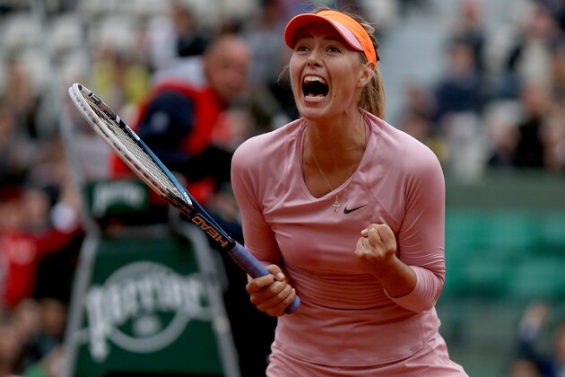 PARIS, FRANCE - JUNE 01:  Maria Sharapova of Russia celebrates victory in her women's singles match against Samantha Stosur of Australia on day eight of the French Open at Roland Garros on June 1, 2014 in Paris, France.  (Photo by Matthew Stockman/Getty Images)