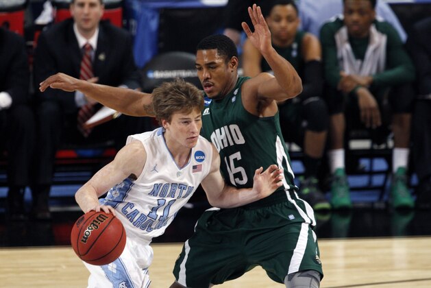 North Carolina Tar Heels guard Stilman White is defended by Ohio Bobcats' Nick Kellogg during the first half of an NCAA tournament Midwest Regional college basketball game Friday, March 23, 2012, in St. Louis.  (AP Photo/Kiichiro Sato)