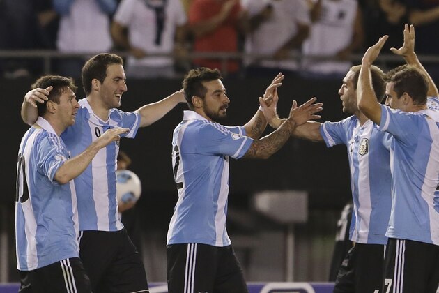 Argentina's Gonzalo Higuain, second left, celebrates scoring against Venezuela with teammates Lionel Messi, left, Ezequiel Lavezzi, center, Pablo Zabaleta, second right, and Walter Montillo during a World Cup 2014 qualifying soccer match in Buenos Aires, Argentina,  Friday, March 22, 2013. (AP Photo/Natacha Pisarenko)