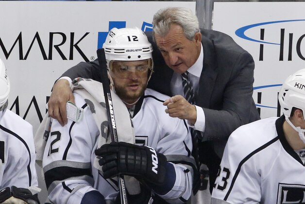 Los Angeles Kings' Marian Gaborik (12) gets instruction from Darryl Sutter in the first period of an NHL hockey game against the Pittsburgh Penguins in Pittsburgh, Thursday, March 27, 2014. The Kings won 3-2. (AP Photo/Gene J. Puskar)