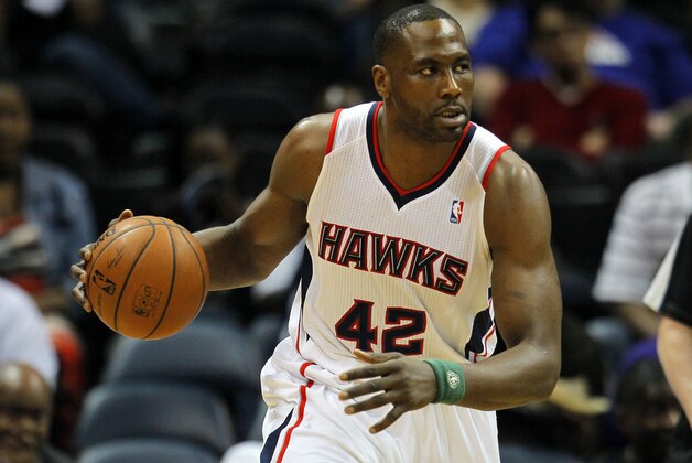 Atlanta Hawks forward Elton Brand (42) dribbles in an NBA basketball game against the Detroit Pistons in Atlanta, Tuesday, April 8, 2014. The Pistons won the game 102-95 (AP Photo/Todd Kirkland)