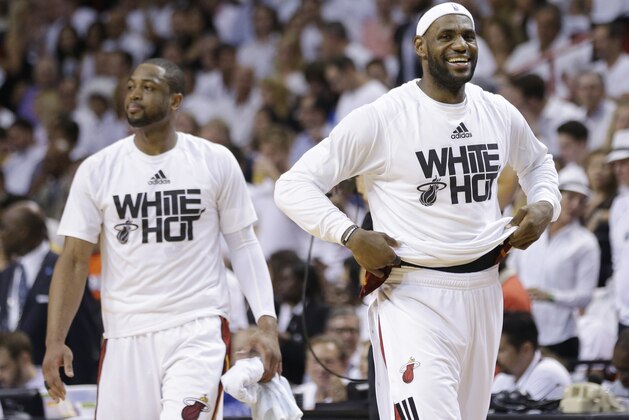 Miami Heat forward LeBron James, right, and guard Dwyane Wade smile during the second half Game 6 in the NBA basketball playoffs Eastern Conference finals against the Indiana Pacers, Friday, May 30, 2014, in Miami. The Miami Heat defeated the Indiana Pacers 117-92 to advance to the NBA Finals. (AP Photo/Lynne Sladky)