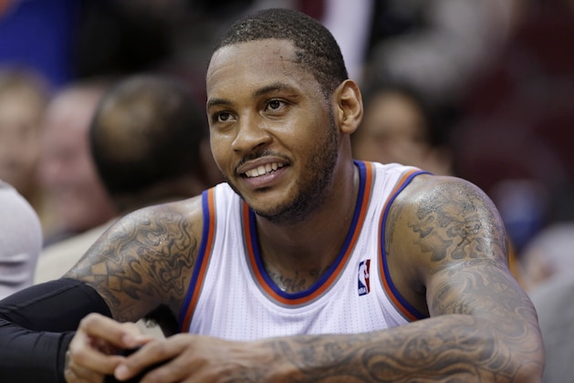 New York Knicks' Carmelo Anthony smiles during the fourth quarter of an NBA basketball game against the Cleveland Cavaliers Saturday, March 8, 2014, in Cleveland. (AP Photo/Tony Dejak)
