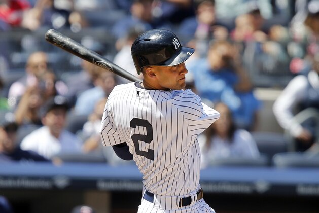 New York Yankees' Derek Jeter follows through on an RBI-single during the fourth inning of a baseball game against the Minnesota Twins, Sunday, June 1, 2014, in New York. (AP Photo/Jason DeCrow)