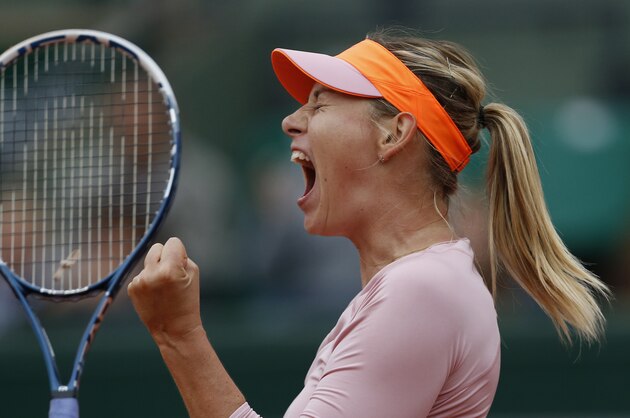 Russia's Maria Sharapova celebrates scoring a point during the fourth round match of the French Open tennis tournament against Australia's Samantha Stosur at the Roland Garros stadium, in Paris, France, Sunday, June 1, 2014. Sharapova won in three sets 3-6, 6-4, 6-0. (AP Photo/Darko Vojinovic) Russia's Maria Sharapova celebrates scoring a point during the fourth round match of the French Open tennis tournament against Australia's Samantha Stosur at the Roland Garros stadium, in Paris, France, Sunday, June 1, 2014. Sharapova won in three sets 3-6, 6-4, 6-0. (AP Photo/Darko Vojinovic)
