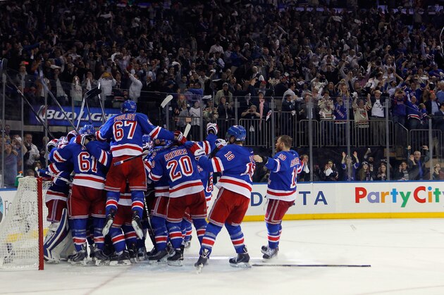 NEW YORK, NY - MAY 29:  The New York Rangers celebrates after defeating the Montreal Canadiens in Game Six to win the Eastern Conference Final in the 2014 NHL Stanley Cup Playoffs at Madison Square Garden on May 29, 2014 in New York City. The New York Rangers defeated the Montreal Canadiens 1 to 0.  (Photo by Mike Stobe/Getty Images)