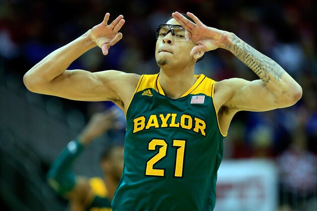 KANSAS CITY, MO - MARCH 13:  Isaiah Austin #21 of the Baylor Bears reacts after shooting a three-pointer during the Big 12 Basketball Tournament quarterfinal game against the Oklahoma Sooners at Sprint Center on March 13, 2014 in Kansas City, Missouri.  (Photo by Jamie Squire/Getty Images)