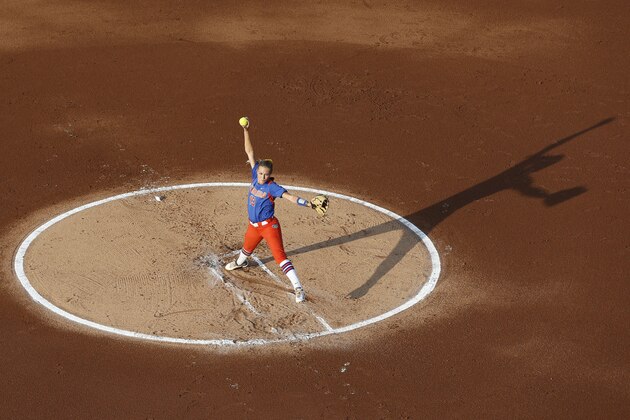 Florida pitcher Hannah Rogers pitches in the first inning of an NCAA Women's College World Series softball tournament game against Alabama in Oklahoma City, Monday, June 2, 2014. (AP Photo/Sue Ogrocki)