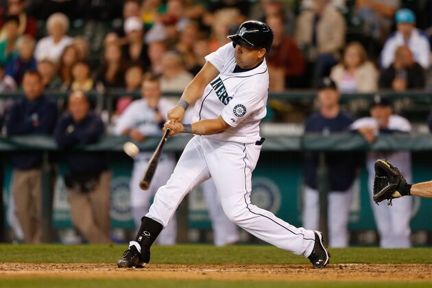 SEATTLE, WA - JUNE 23:  Kendrys Morales #8 of the Seattle Mariners hits a walk-off three-run home run in the tenth inning against the Oakland Athletics at Safeco Field on June 23, 2013 in Seattle, Washington. The Mariners defeated the Athletics 6-3.  (Photo by Otto Greule Jr/Getty Images)