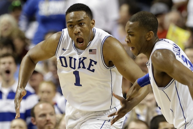 Duke's Jabari Parker, left, reacts with teammate Rasheed Sulaimon, right, after a basket against North Carolina State during the second half of an NCAA college basketball game in the semifinals of the Atlantic Coast Conference tournament in Greensboro, N.C., Saturday, March 15, 2014. (AP Photo/Gerry Broome)