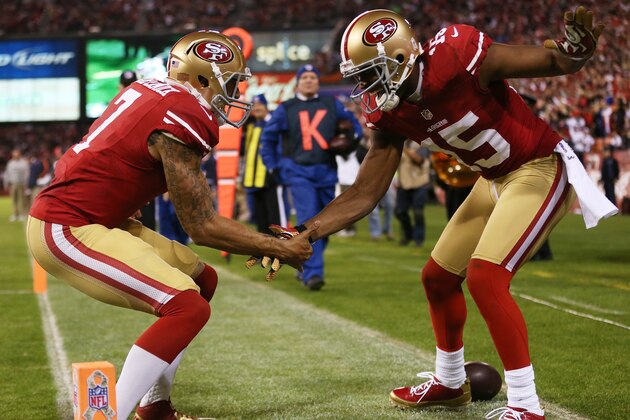 SAN FRANCISCO, CA - NOVEMBER 19:  Michael Crabtree #15 of the San Francisco 49ers and Colin Kaepernick #7 of the San Francisco 49ers celebrate Crabtree's third quarter touchdown against the Chicago Bears at Candlestick Park on November 19, 2012 in San Francisco, California.  (Photo by Ezra Shaw/Getty Images)