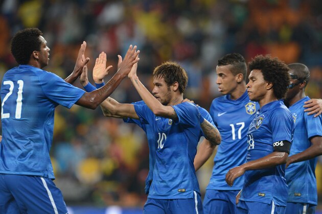 JOHANNESBURG, SOUTH AFRICA - MARCH 05: Neymar celebrates his goal with teammtes  during the International Friendly match between South Africa and Brazil at FNB Stadium on March 05, 2014 in Johannesburg, South Africa. (Photo by Lefty Shivambu/Gallo Images/Getty Images)
