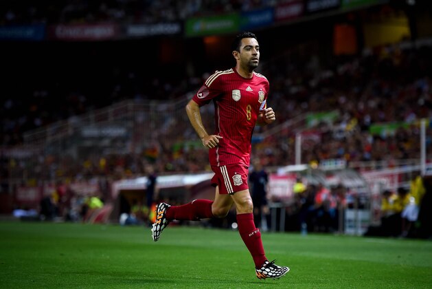 SEVILLE, SPAIN - MAY 30:  Xavi Hernandez of Spain looks on during an international friendly match between Spain and Bolivia at Estadio Ramon Sanchez Pizjuan on May 30, 2014 in Seville, Spain.  (Photo by David Ramos/Getty Images)