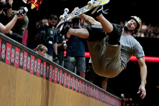 Bucky Lasek competes during the Skateboard Vert final at the X Games in Los Angeles, Saturday, July 30, 2011. Lasek won the bronze medal in the event. (AP Photo/Bret Hartman)