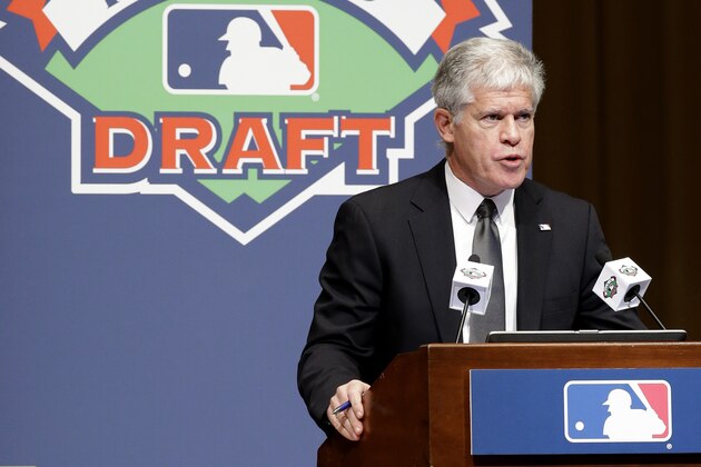 Roy Krasik, senior director of Major League Baseball operations, directs the Rule 5 draft at the baseball winter meetings on Thursday, Dec. 6, 2012, in Nashville, Tenn. (AP Photo/Mark Humphrey)