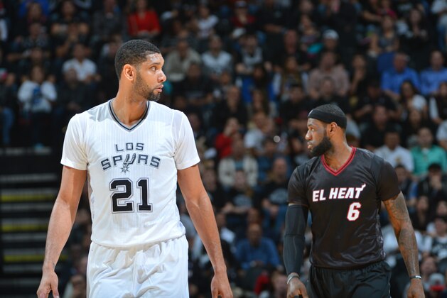 SAN ANTONIO, TX - MARCH 6: Tim Duncan #21 of the San Antonio Spurs and LeBron James #6 of the Miami Heat during a game at the AT&T Center March 6, 2014 in San Antonio, Texas. NOTE TO USER: User expressly acknowledges and agrees that, by downloading and or using this photograph, User is consenting to the terms and conditions of the Getty Images License Agreement. Mandatory Copyright Notice: Copyright 2014 NBAE (Photo by Jesse D. Garrabrant/NBAE via Getty Images)