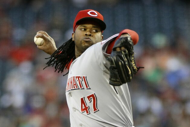Cincinnati Reds' Johnny Cueto delivers a pitch against the Arizona Diamondbacks during the first inning of a baseball game on Saturday, May 31, 2014, in Phoenix. (AP Photo/Ralph Freso)