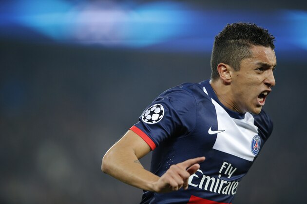 PSG's Marquinhos celebrates his side's first goal during a Champions League last 16 second leg soccer match between Paris Saint Germain against Bayer Leverkusen at Parc des Princes stadium in Paris, Wednesday, March 12, 2014. (AP Photo/Michel Euler)