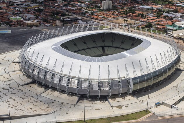 FILE- This March 13, 2014, file photo released by Portal da Copa shows an aerial view of the Castelao stadium in Fortaleza, Brazil. Castelao will host matches during the 2014 World Cup soccer tournament. (AP Photo/Fabio Lima, Portal da Copa, File) - SEE FURTHER WORLD CUP CONTENT AT APIMAGES.COM
