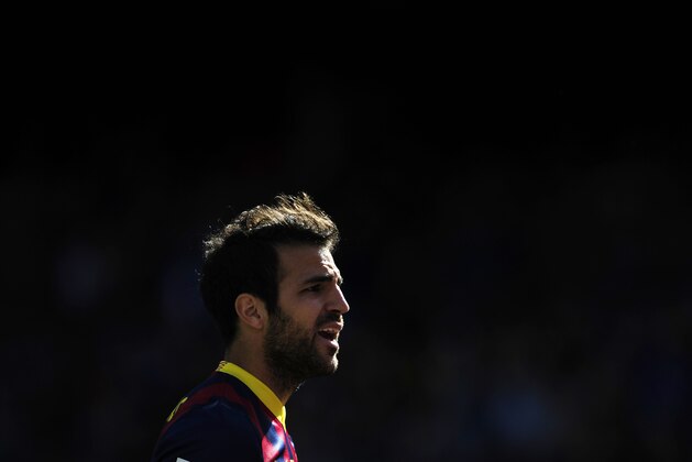 FC Barcelona's Cesc Fabregas looks on during a Spanish La Liga soccer match against Getafe at the Camp Nou stadium in Barcelona, Spain, Saturday May 3, 2014. (AP Photo/Manu Fernandez)