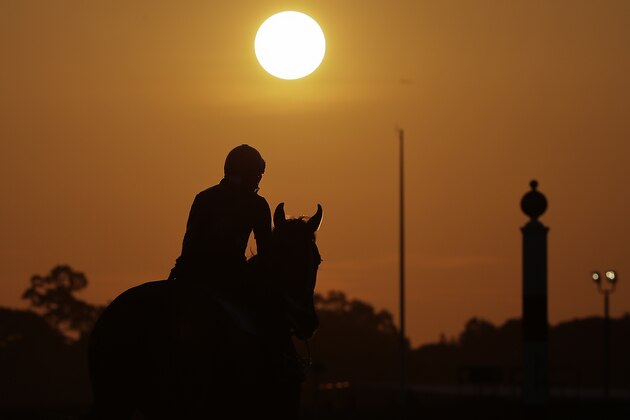 An exercise rider gallops a horse around the track as the sun rises during a workout at Belmont Park, Tuesday, June 3, 2014, in Elmont, N.Y. Kentucky Derby and Preakness Stakes winner California Chrome will attempt to become the first Triple Crown winner since Affirmed in 1978 when he races in the146th running of the Belmont Stakes on Saturday. (AP Photo/Julie Jacobson) An exercise rider gallops a horse around the track as the sun rises during a workout at Belmont Park, Tuesday, June 3, 2014, in Elmont, N.Y. Kentucky Derby and Preakness Stakes winner California Chrome will attempt to become the first Triple Crown winner since Affirmed in 1978 when he races in the146th running of the Belmont Stakes on Saturday. (AP Photo/Julie Jacobson)