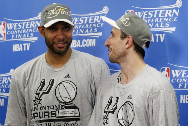 San Antonio Spurs' Tim Duncan, left and Manu Ginobili talk following Game 6 of the Western Conference finals NBA basketball playoff series against the Oklahoma City Thunder in Oklahoma City, Saturday, May 31, 2014. San Antonio won 112-107, and advanced to the NBA Finals. (AP Photo/Sue Ogrocki, Pool)