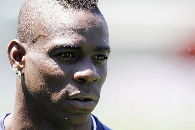 Italy forward Mario Balotelli attends a training session at the Coverciano center, near Florence, Italy, Monday, June 2, 2014. Italy opens its World Cup campaign against England in Group D on June 14 then faces Costa Rica on June 20 and Uruguay on June 24. The Azzurri play Luxembourg in Perugia on Wednesday then fly out to Brazil a day later. (AP Photo/Fabrizio Giovannozzi)