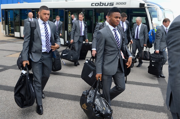 LUTON, ENGLAND - JUNE 01:  In this handout image supplied by the FA, Alex Oxlade-Chamberlain (L) and Raheem Sterling of England with the rest of the squad prepare to board a plane leaving for the 2014 Brazil World Cup on June 1, 2014 in Luton, England.  (Photo by The FA/The FA via Getty Images)
