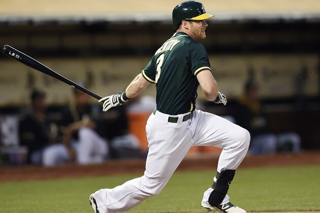 OAKLAND, CA - MAY 13:  Craig Gentry #3 of the Oakland Athletics hits an RBI single scoring Josh Reddick #16 against the Chicago White Sox in the bottom of the fourth inning at O.co Coliseum on May 13, 2014 in Oakland, California.  (Photo by Thearon W. Henderson/Getty Images)