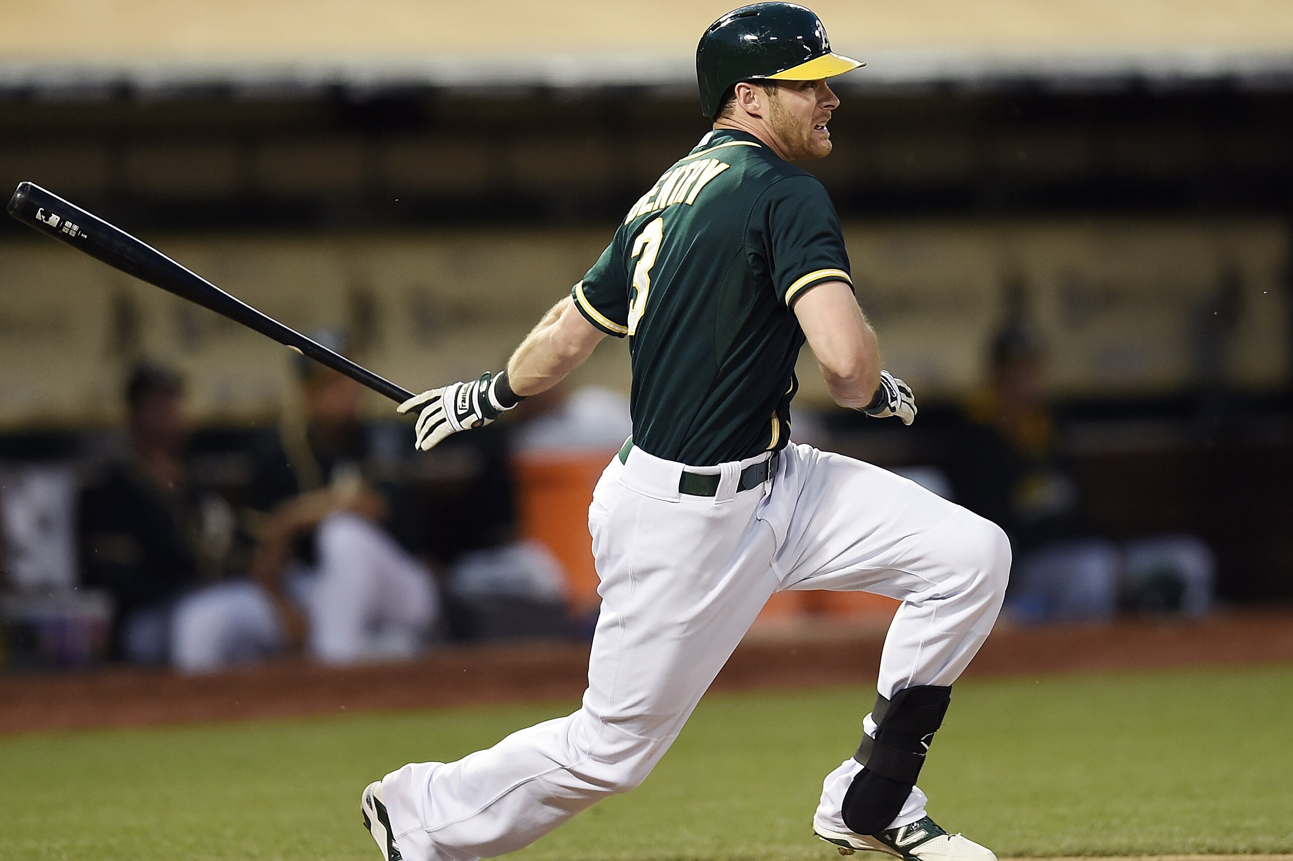 OAKLAND, CA - MAY 13:  Craig Gentry #3 of the Oakland Athletics hits an RBI single scoring Josh Reddick #16 against the Chicago White Sox in the bottom of the fourth inning at O.co Coliseum on May 13, 2014 in Oakland, California.  (Photo by Thearon W. Henderson/Getty Images)